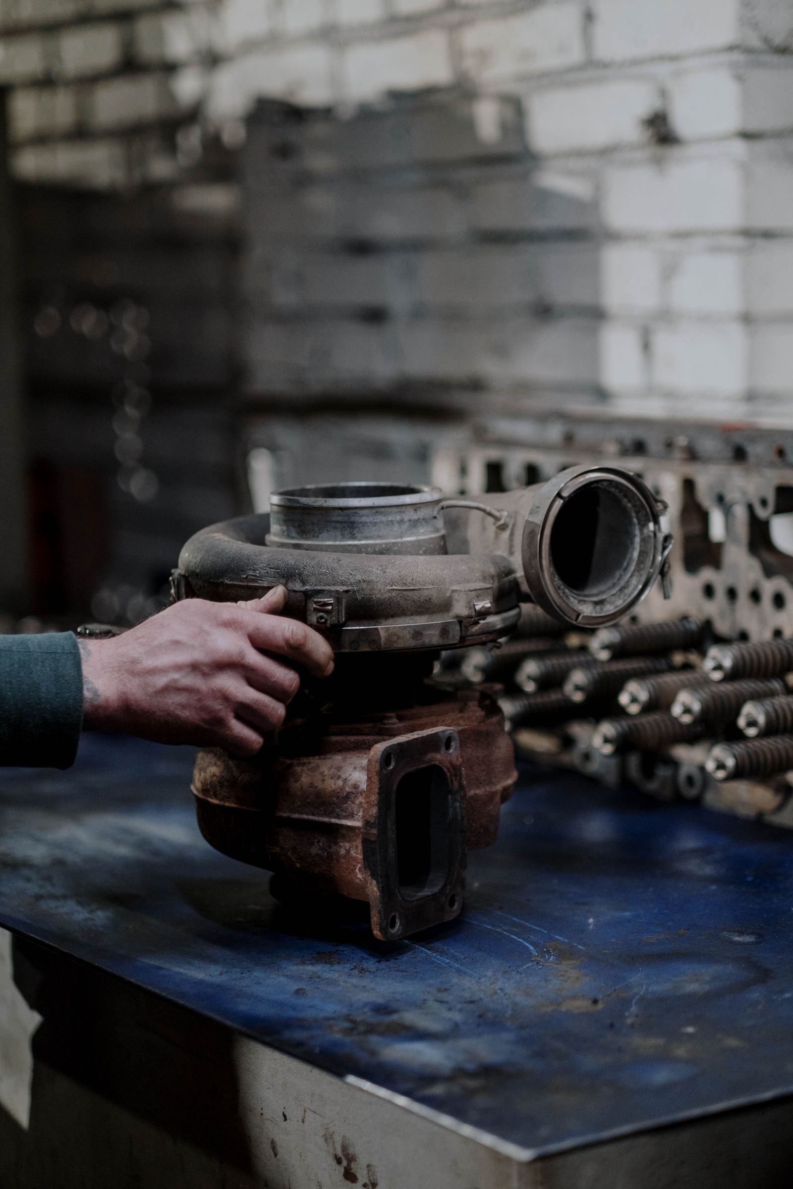 Turbocharger being inspected on a workshop bench